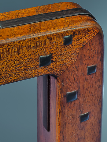 Detail shot of joint connecting bed legs to top rails.